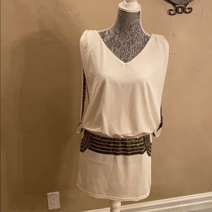 Flattering loose top, tight bottom dress